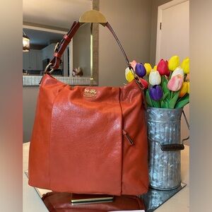 COA Included: Coach Madison persimmon leather Isabelle with gold hardware